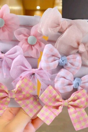 Ganchitos de colores rosados de chongo